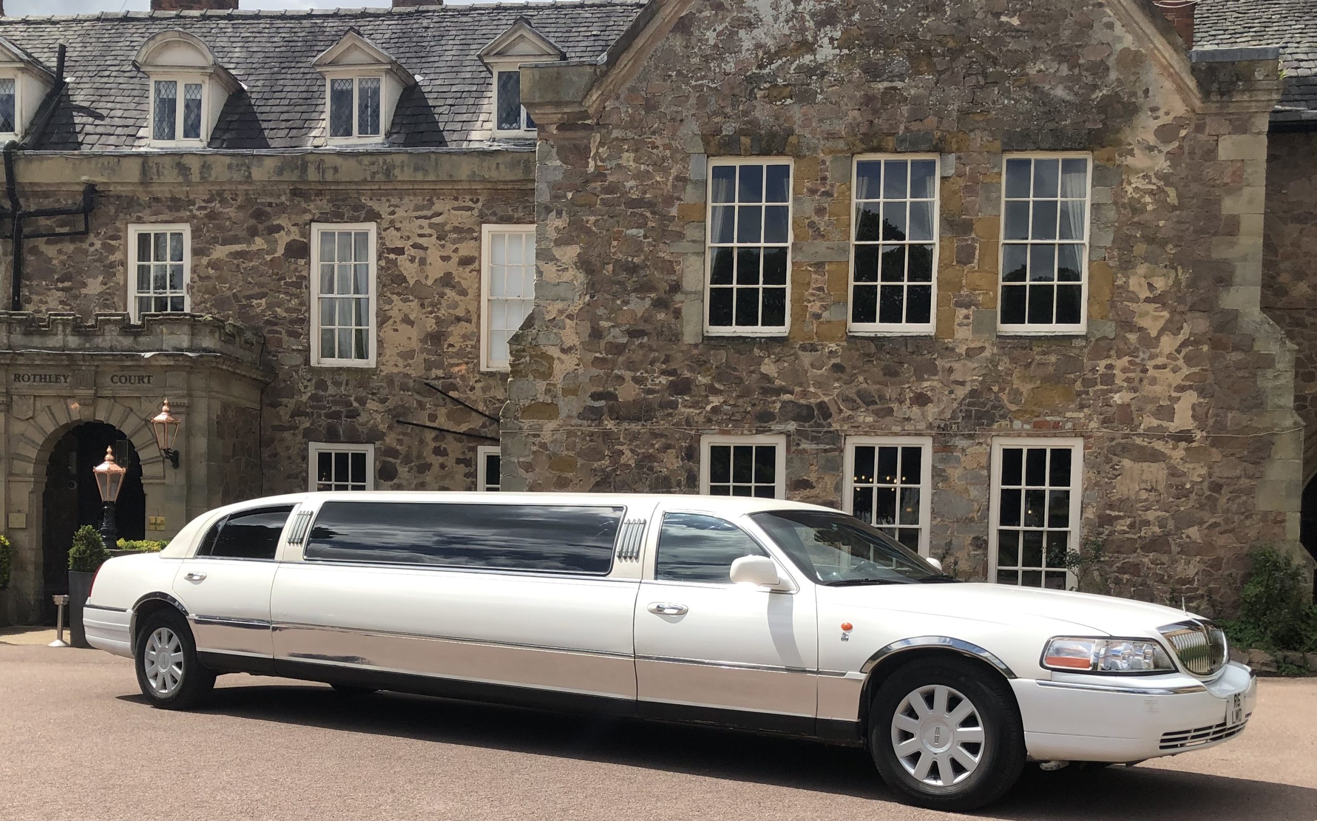 Tamworth Lincoln Town car beside park